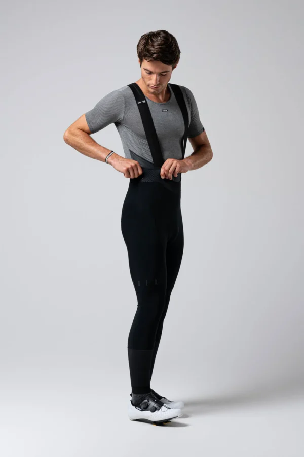 Culotte largo de ciclismo con protección térmica DUAL-SHIELD, badana K7, tirantes transpirables y detalles reflectantes, ideal para entrenamientos en temperaturas de 0-15 ºC. Ofrece aislamiento, transpirabilidad y confort durante rutas largas.