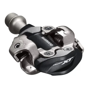 "Pedales Shimano XT M8100 XC SPD para ciclismo de montaña, diseño ligero y resistente, compatibles con SPD, ideales para cross-country, con excelente evacuación de barro."