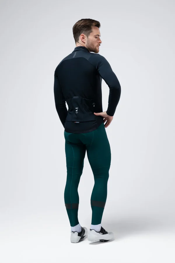 Description: Ultra-elastic version of our iconic winter jacket, a true benchmark in thermal comfort and aerodynamics for the coldest months. Thanks to a solid fabric made with micro polyamide, we achieve complete freedom of movement with a very pleasant feel. The front panel with Polartec® Windbloc™ offers wind protection, water repellency, and exceptional breathability, ensuring the perfect balance between insulation and ventilation. The interior with microfleece provides extra warmth in extreme conditions, while the exterior receives an additional water-repellent treatment, providing total protection against moisture. The sleeves have been made with Polartec® Power Shield™ protection on the upper part and a lower panel in winter lycra that achieves an optimal balance between protection and comfort. Its design has also evolved, with sharper side panels, an optimized back silhouette, and new minimalist cuffs. It maintains its Perfect Fit fit, snug but adaptable to different types of cyclists and disciplines. In terms of storage, it has three rear pockets with the GRS system and a lower gusset to improve ventilation, as well as a fourth zippered pocket to securely store valuables. A jacket that redefines the standard of protection and performance in winter. New optimized pattern. Fabric with Polartec® Windbloc™. Additional exterior water-repellent treatment. Back with breathable microfleece. Sleeves with Polartec® Power Shield™. Minimalist cuffs. Thermo-sealed zipper with protectors and puller. 3 rear pockets with GRS system. Extra zippered pocket. Large-format interior mesh pocket. Waist with rear silicone band. Reflective details.